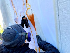 Up close spray painting Fnnch Fisherman's Wharf Honey Bear Mural